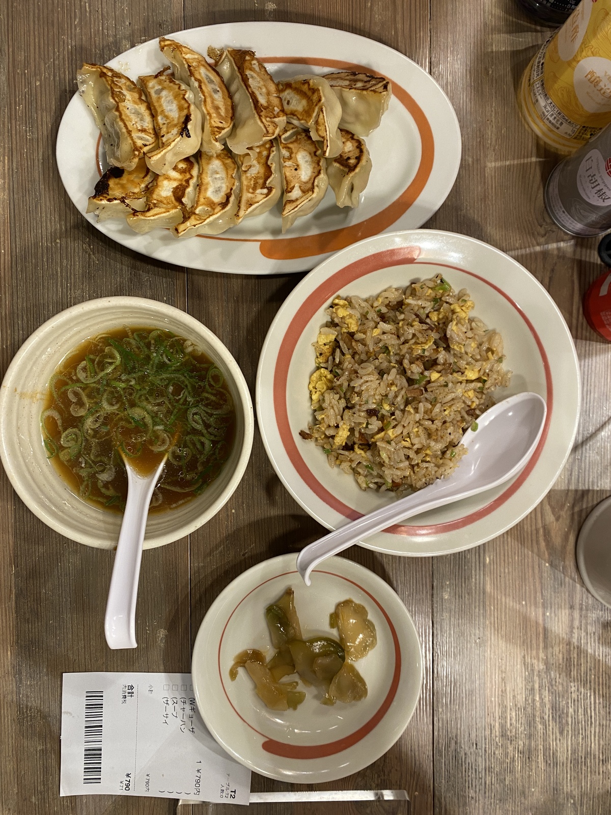 Japanese dinner set with fried rice, gyoza, soup, and pickles